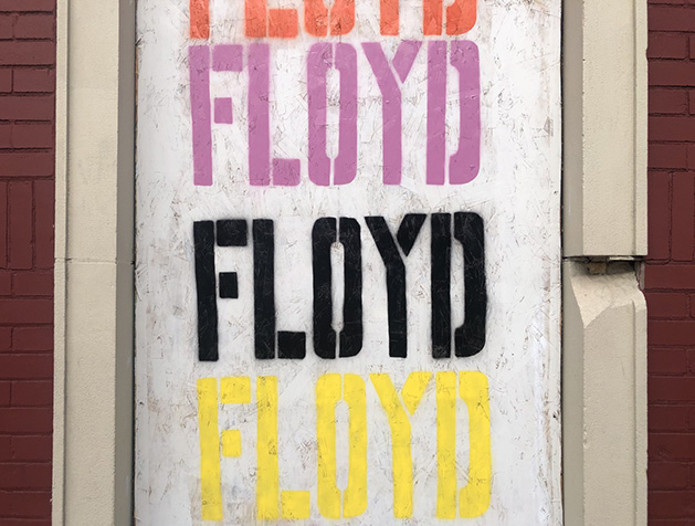 A mural reading "Floyd," honoring George Floyd.